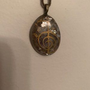 "RA" necklace on leather cord